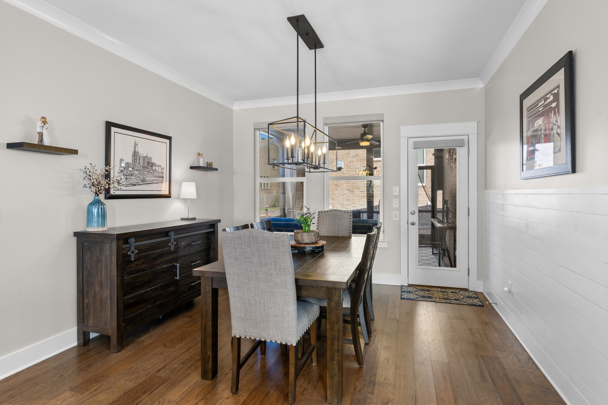 259 Caroline Way Mount Juliet, TN 37122 - Photo 9 of 35 a dining room with furniture a chandelier and wooden floor