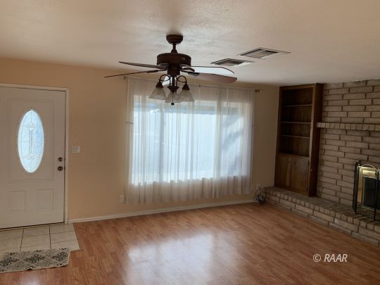 600 South Nevada Street Ridgecrest, CA 93555 - Photo 5 of 30 a view of a livingroom with a fireplace