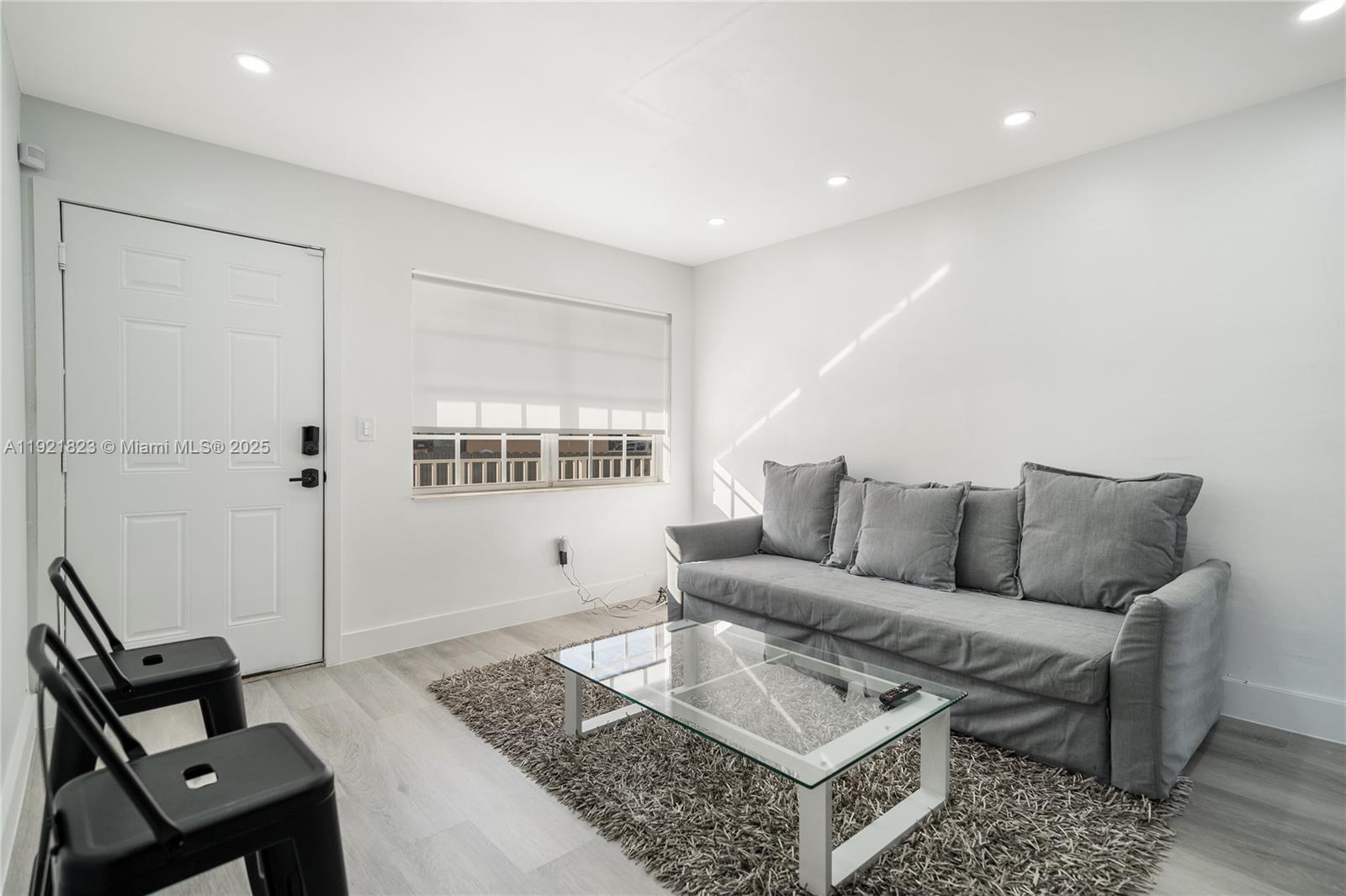 4421 Northwest 9th Street, Unit 4421 Miami, FL 33126 - Photo 3 of 14 a living room with furniture and a window