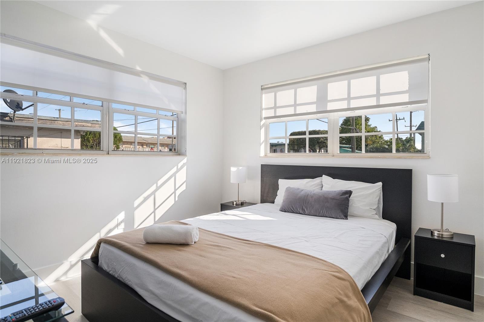 4421 Northwest 9th Street, Unit 4421 Miami, FL 33126 - Photo 6 of 14 a bedroom with a bed and a window