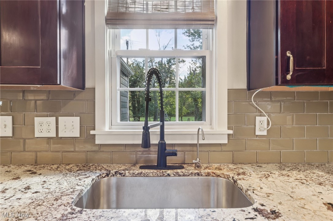 1151 Croyden Road Lyndhurst, OH 44124 - Photo 16 of 37 Kitchen view of tasteful backsplash and light stone countertops