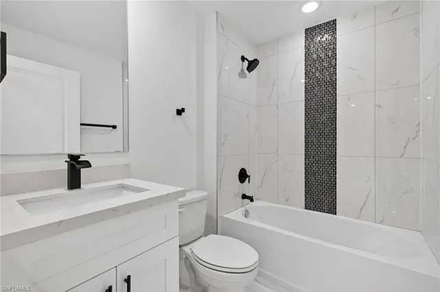 a bathroom with double sink and a mirror