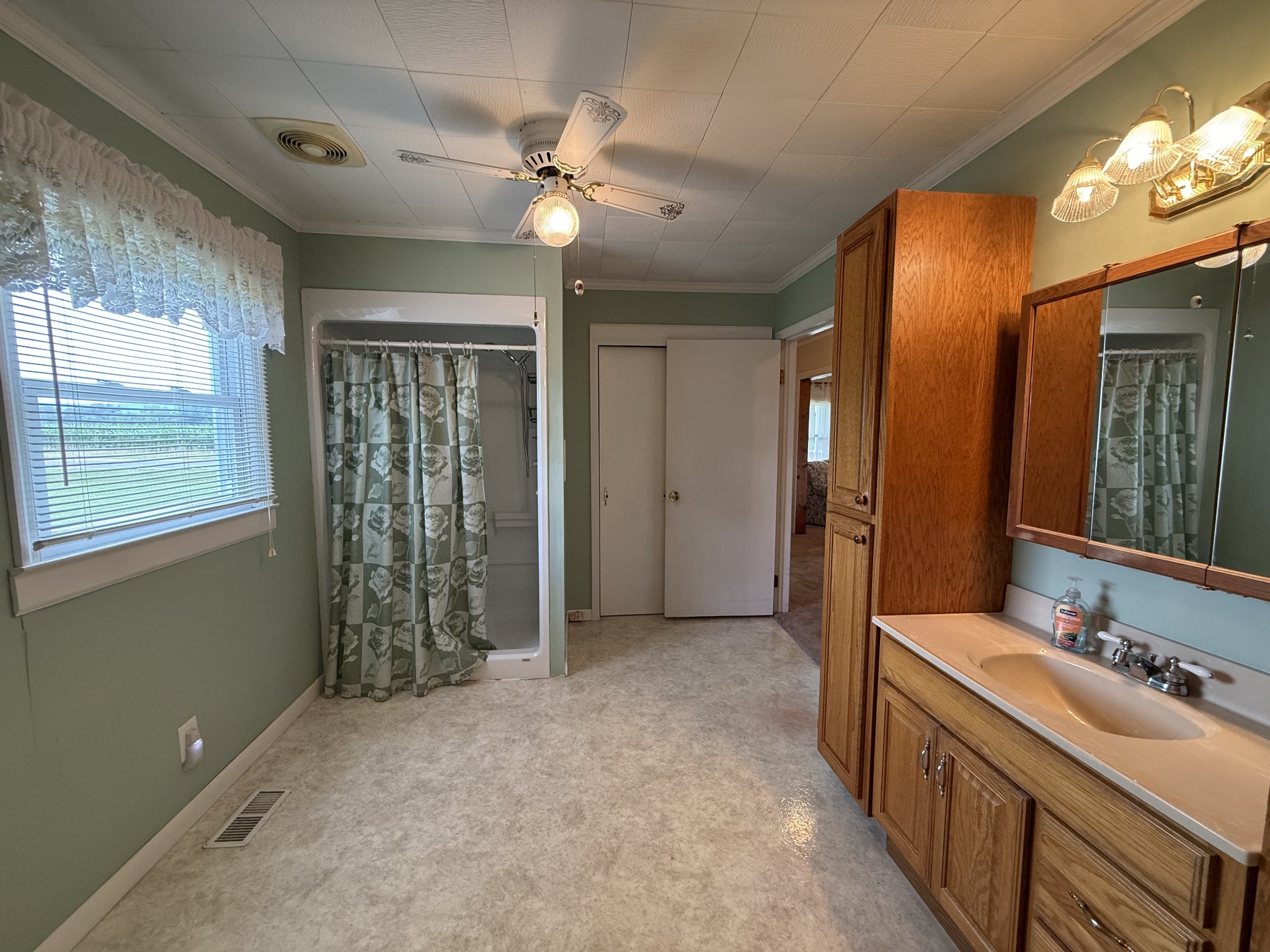 2971 Monroe Floyd Road Decherd, TN 37324 - Photo 19 of 26 a bathroom with a double vanity sink and a mirror