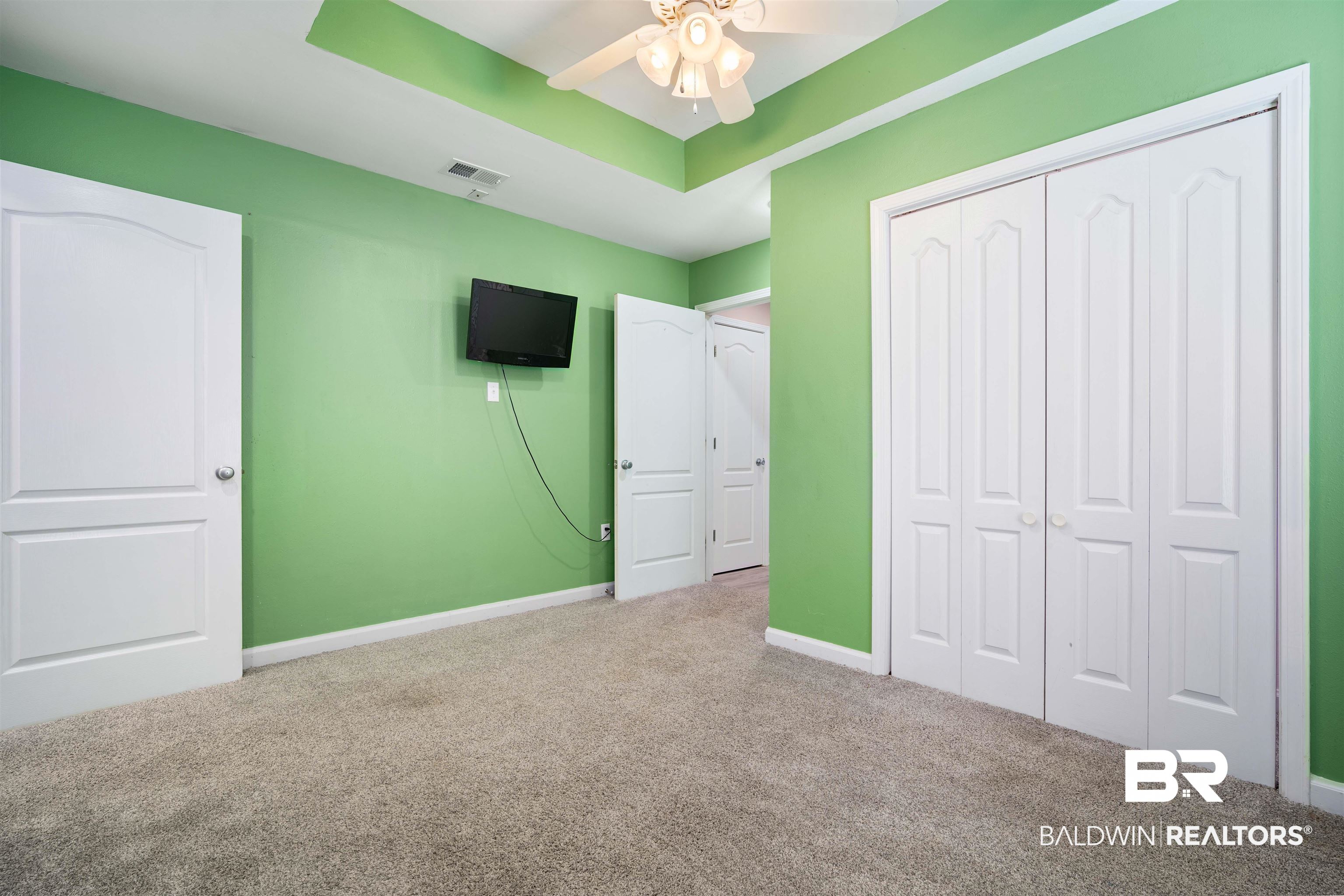 3010 Drag Strip Lane Coden, AL 36523 - Photo 22 of 44 Unfurnished bedroom with ceiling fan, a closet, and carpet floors