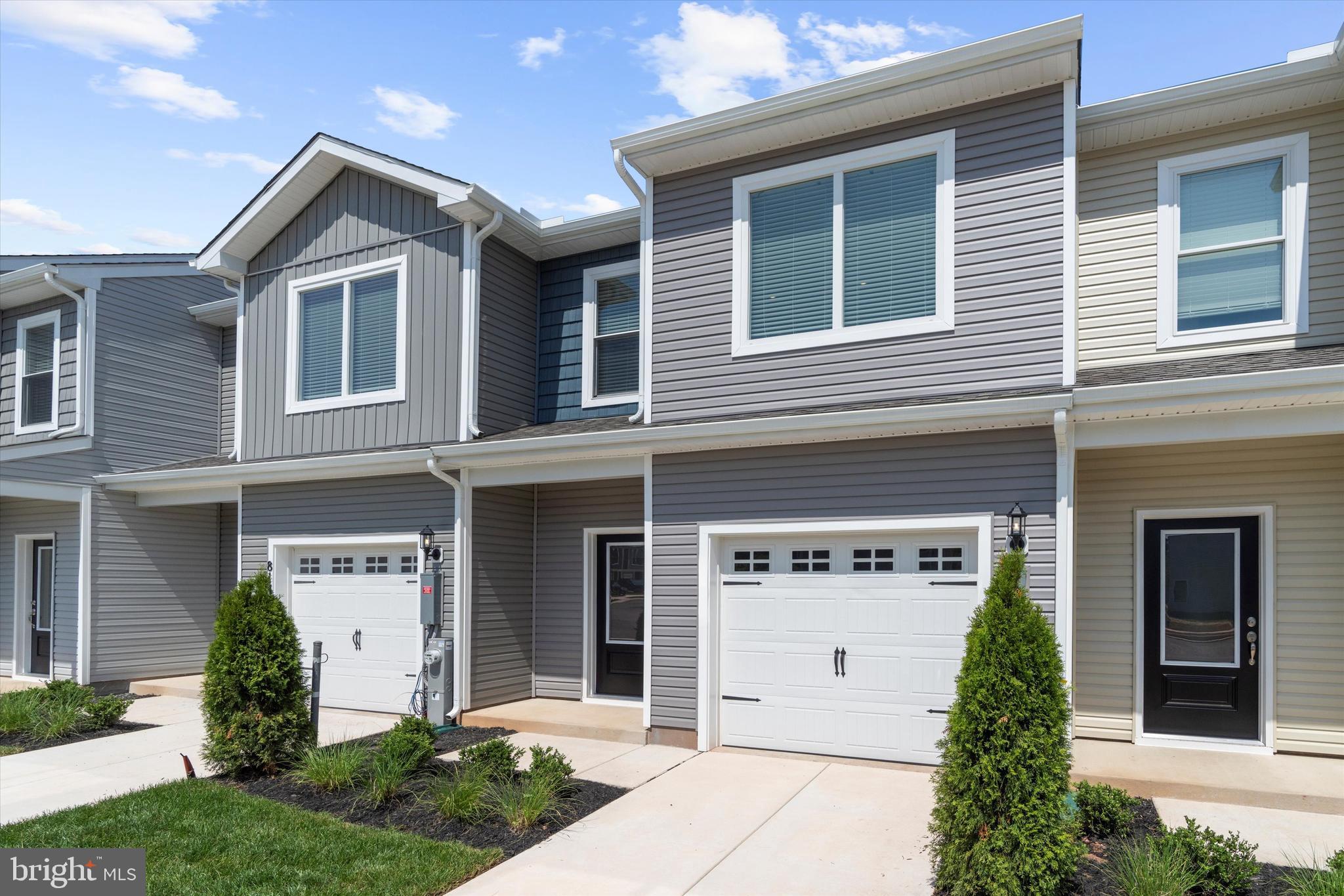 8133 Bartholomew Court Baltimore, MD 21206 - Photo 1 of 14 front view of a house with a yard and an trees