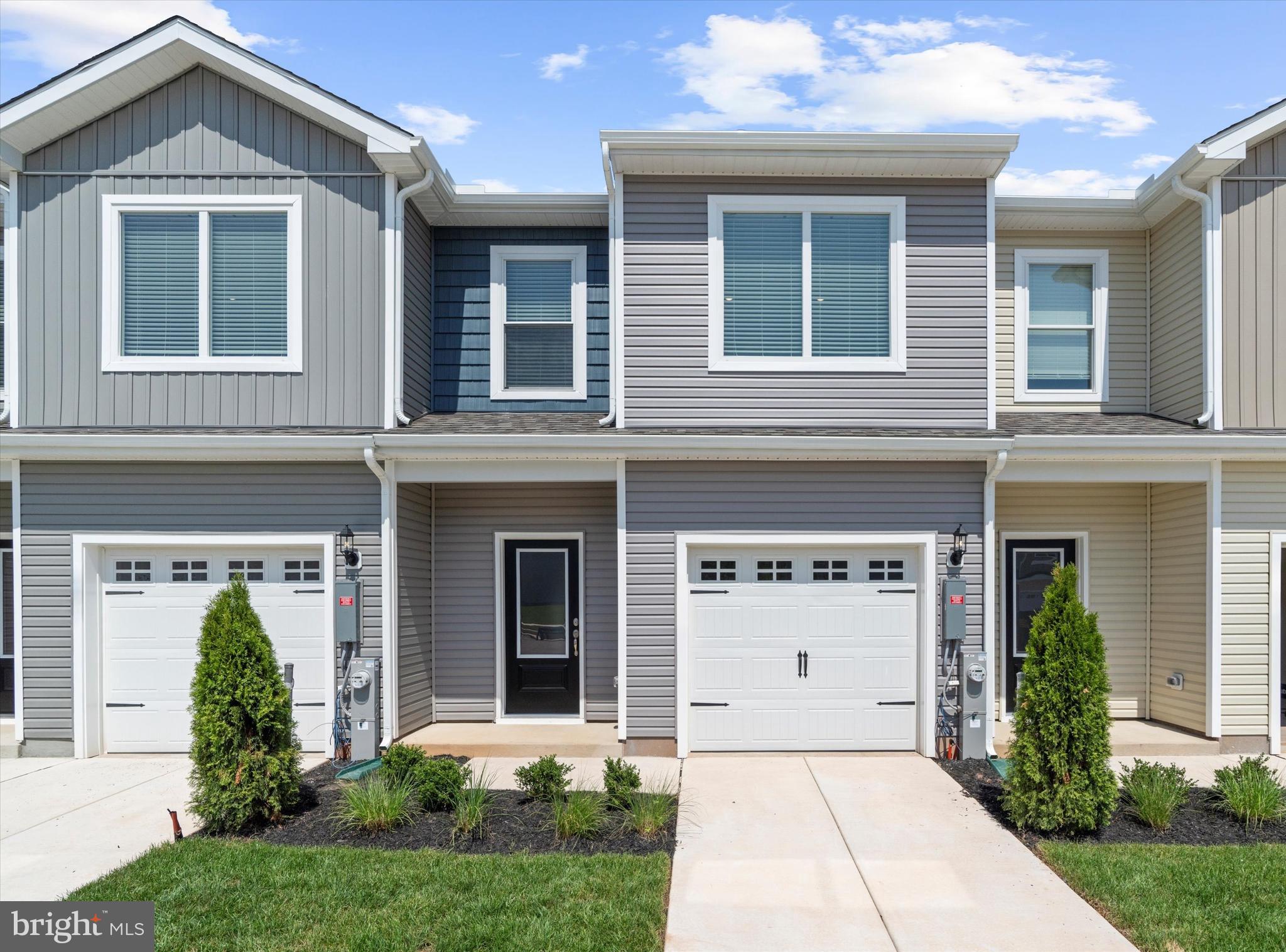 8133 Bartholomew Court Baltimore, MD 21206 - Photo 12 of 14 a front view of a house with garden