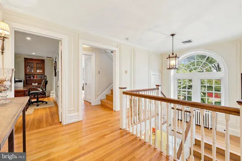 a view of a living room and wooden floor
