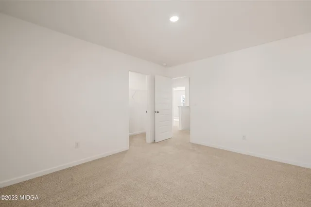 a view of a house with wooden fence