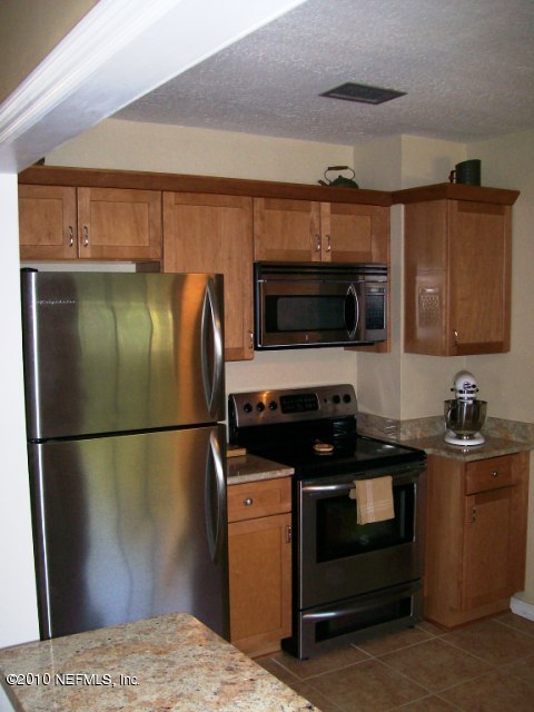 2215 Southampton Road Jacksonville, FL 32207 - Photo 9 of 14 kitchen stove wall