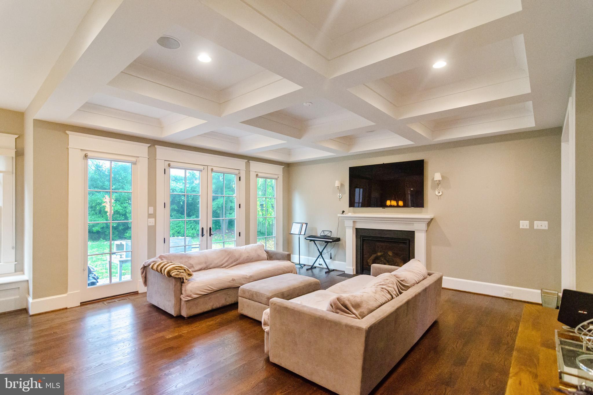 6801 Danforth Street McLean, VA 22101 - Photo 10 of 29 a living room with furniture flat screen tv and a fireplace