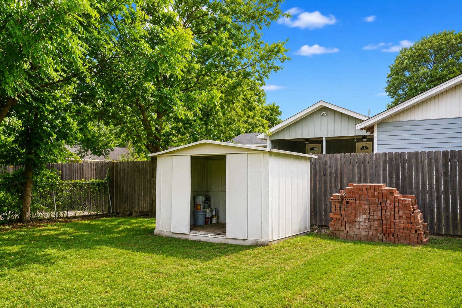 1508 Walnut Street Georgetown, TX 78626 - Photo 20 of 37 A well-maintained yard provides ample outdoor storage with a functional shed.