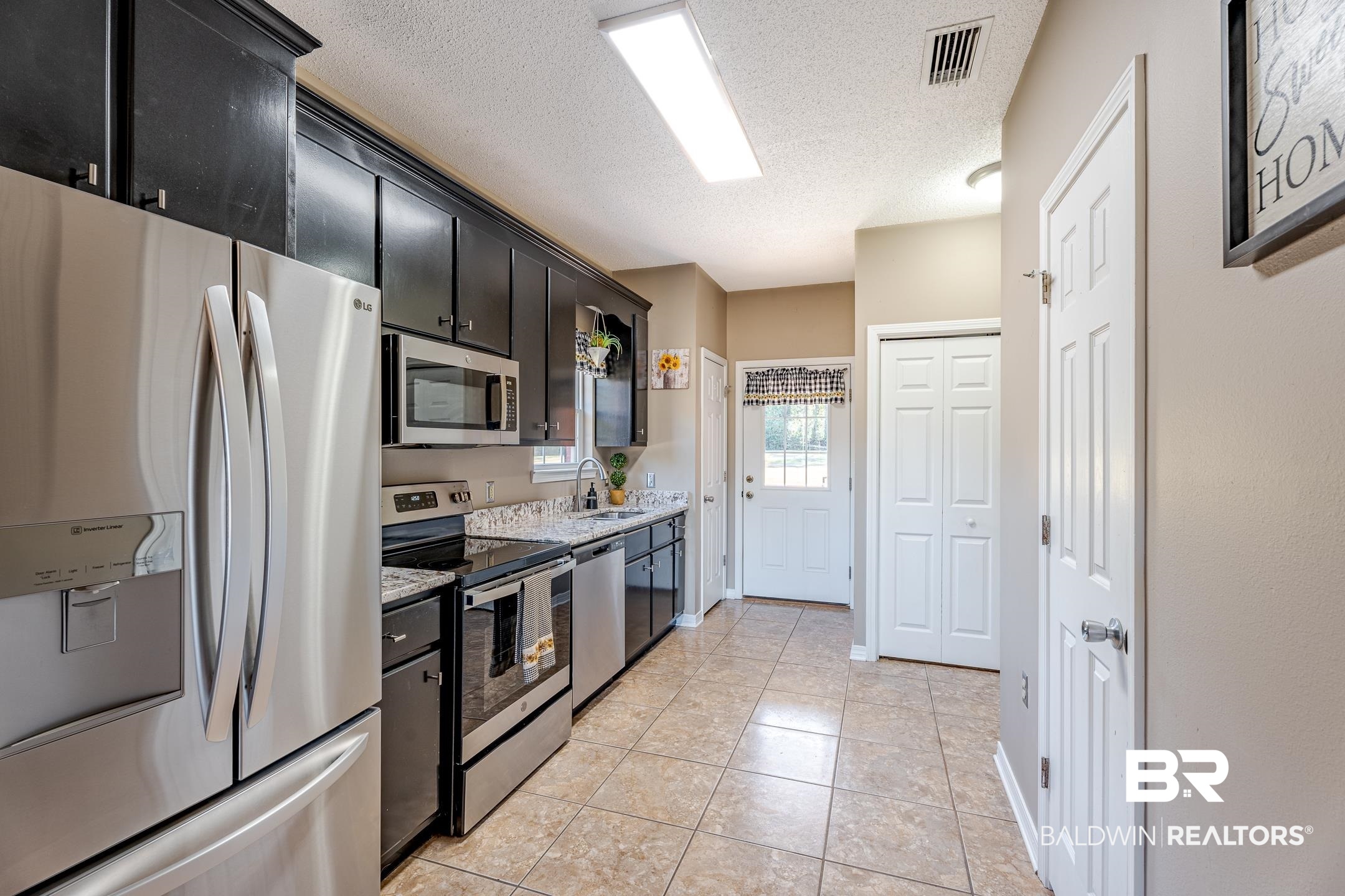12780 Hilliard Jenkins Road Loxley, AL 36551 - Photo 16 of 32 Kitchen to Courtyard