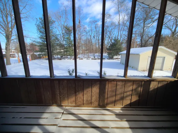 a view of backyard with mountain view and wooden floor