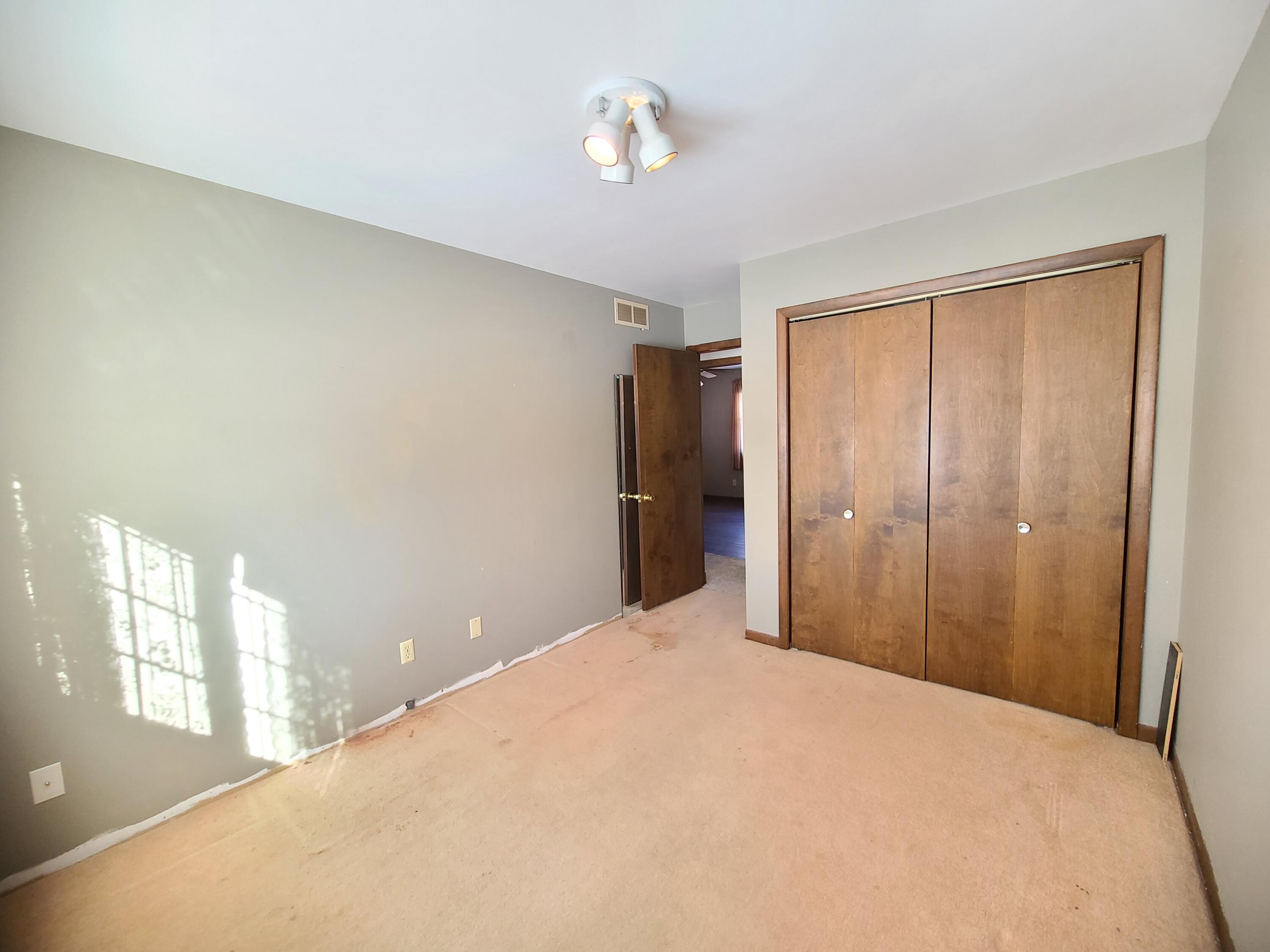 13291 County Road 700 West Demotte, IN 46310 - Photo 27 of 33 a view of empty room with windows and closet