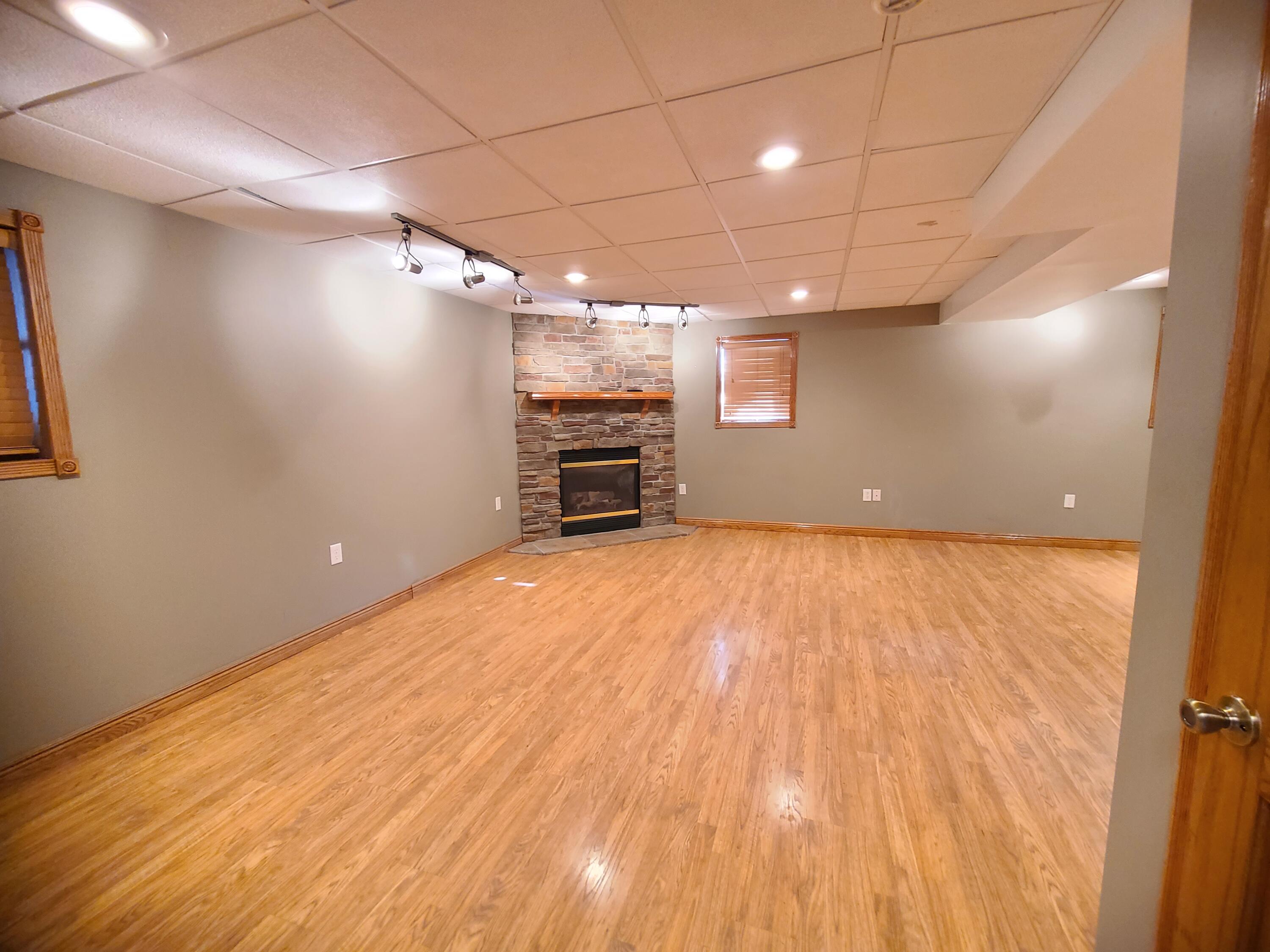 13291 County Road 700 West Demotte, IN 46310 - Photo 28 of 33 an empty room with wooden floor and windows