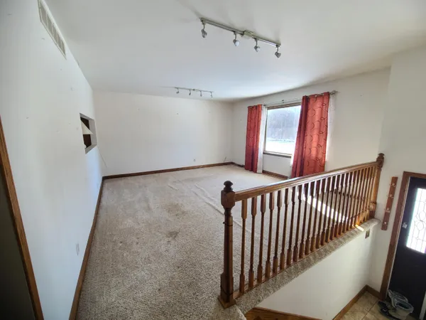 a view of a hallway with windows