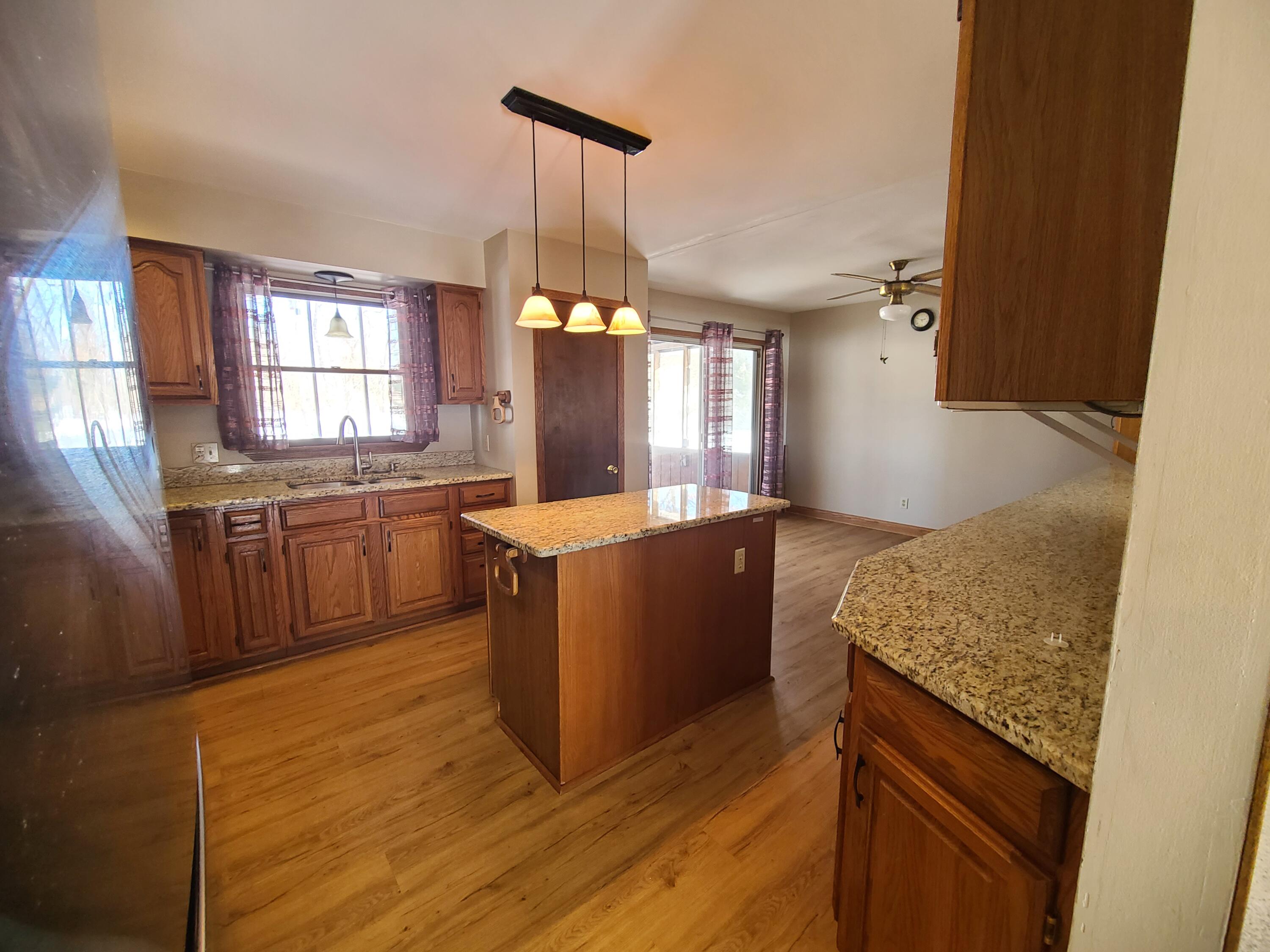 13291 County Road 700 West Demotte, IN 46310 - Photo 8 of 33 a kitchen with granite countertop a stove and a sink