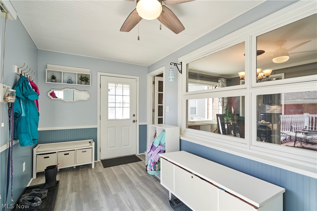 28322 Forest Road Willowick, OH 44095 - Photo 15 of 32 Mudroom with ceiling fan with notable chandelier, a healthy amount of sunlight, and light hardwood / wood-style floors