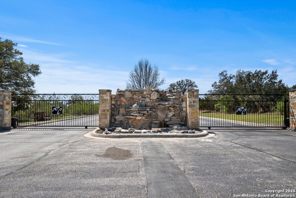 336 River Cliff Place Spring Branch, TX 78070 - Photo 11 of 14 a view of a roadside with a big yard