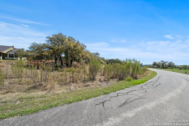 a view of a house with a yard fire pit and outdoor space