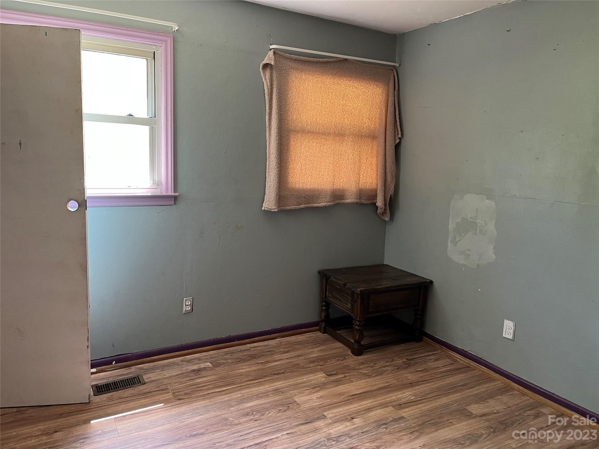 1411 Lackey Mountain Road Hiddenite, NC 28636 - Photo 11 of 19 a view of an empty room with a window