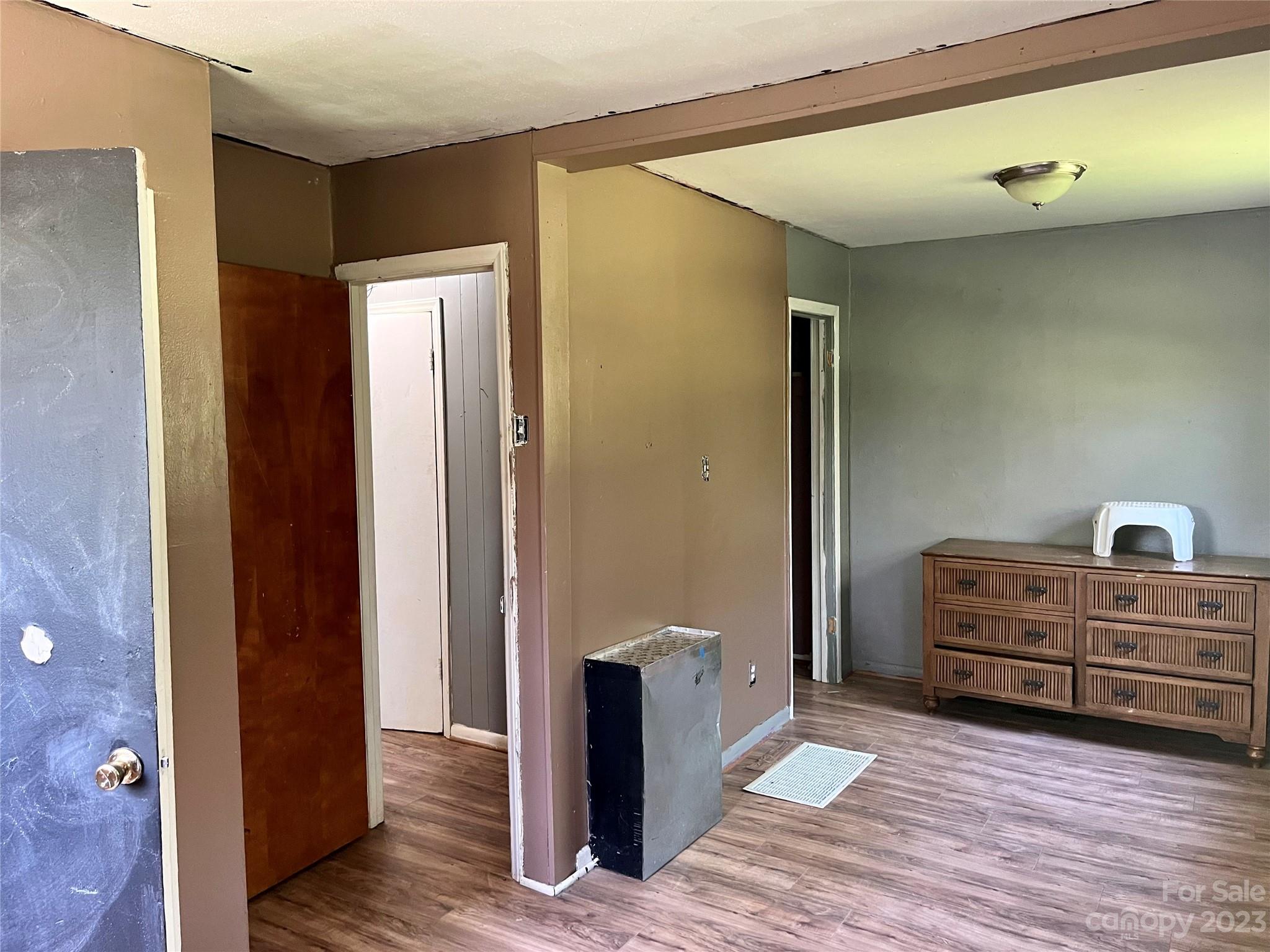 1411 Lackey Mountain Road Hiddenite, NC 28636 - Photo 13 of 19 a view of room with furniture and wooden floor