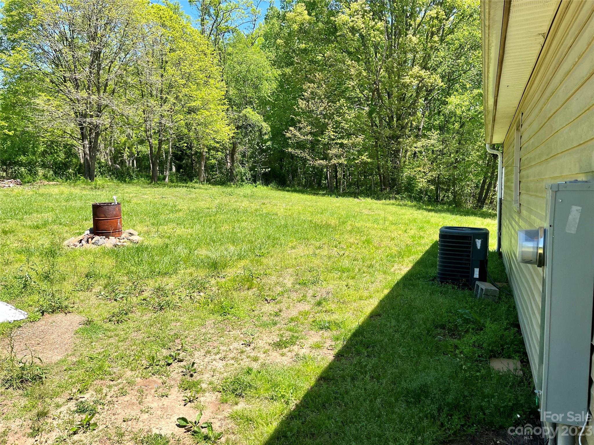 1411 Lackey Mountain Road Hiddenite, NC 28636 - Photo 15 of 19 a view of an outdoor space and a yard