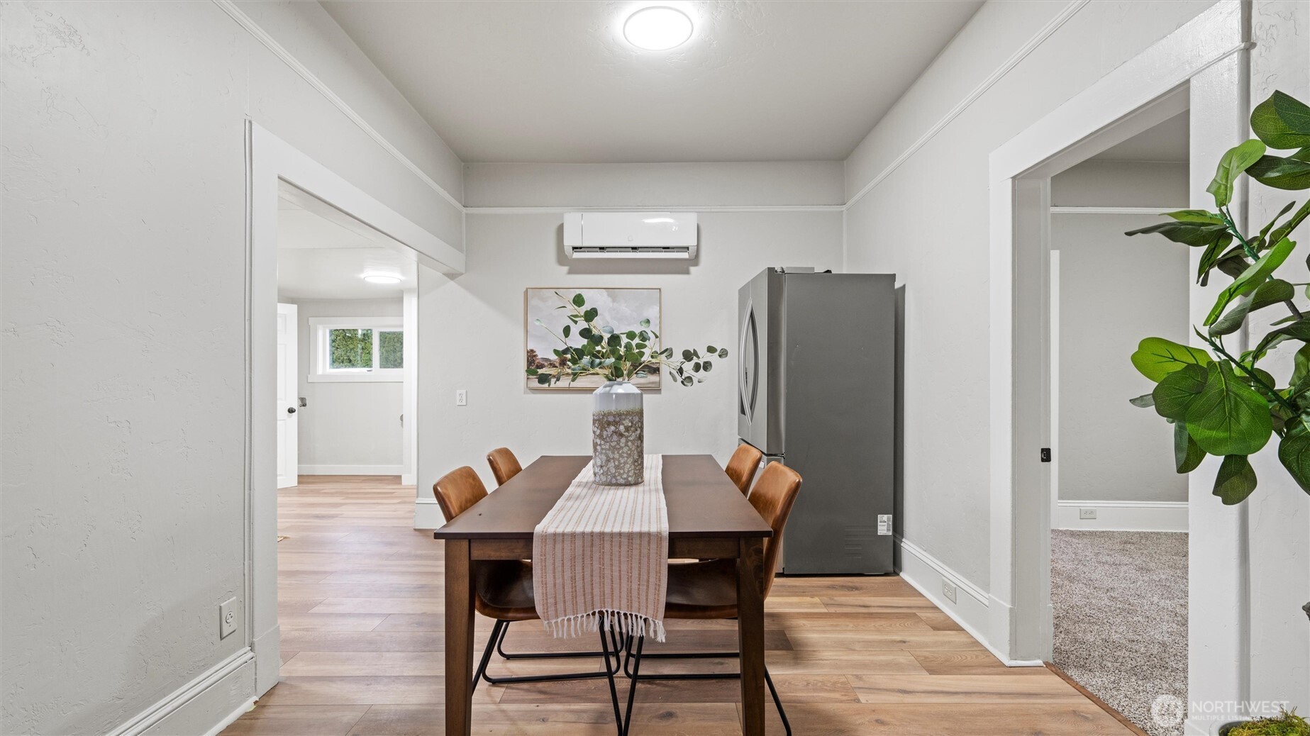 7 Second Street Touchet, WA 99360 - Photo 12 of 33 a view of a dining room with furniture and a potted plant