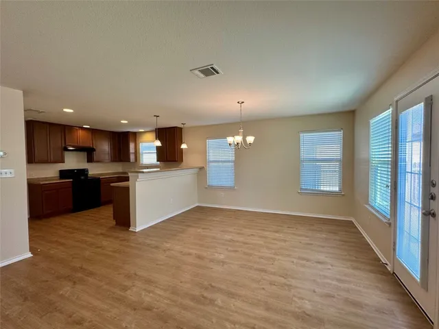 a view of kitchen with wooden floor