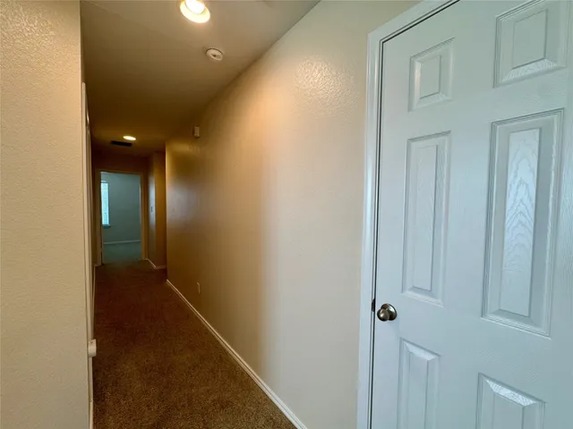 a view of hallway with closet