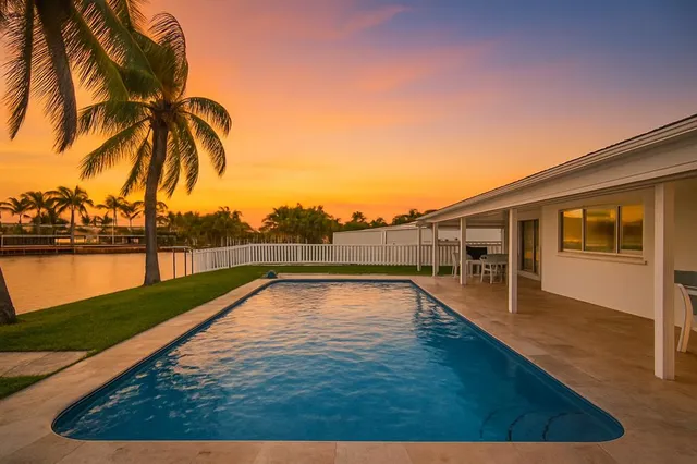 a view of swimming pool with a yard