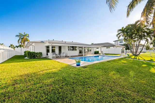 a view of a house with a swimming pool