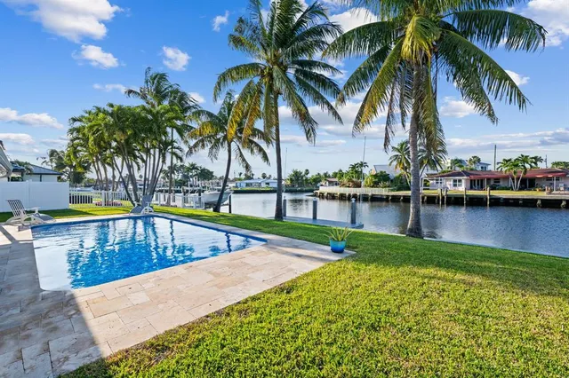 a view of a swimming pool with lounge chair