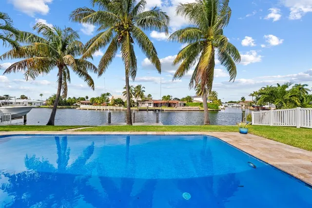 an aerial view of residential houses with city view