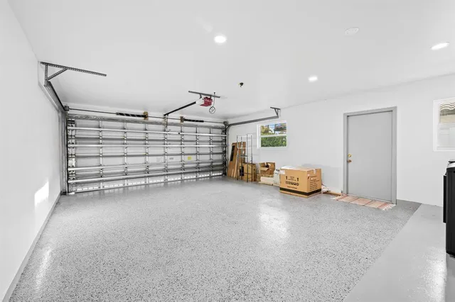 a living room with furniture and a flat screen tv with wooden floor