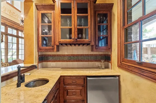 a kitchen with a sink and a window