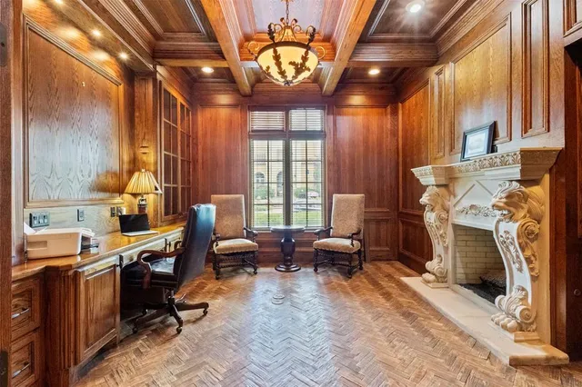 a view of a livingroom with workspace and a window