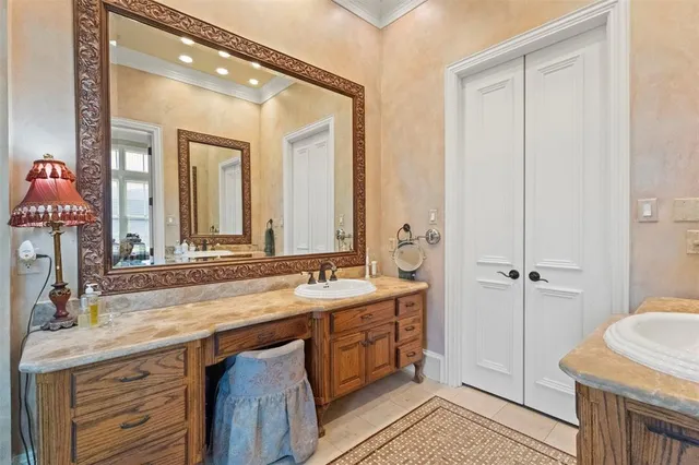 a bathroom with a double vanity sink and mirror