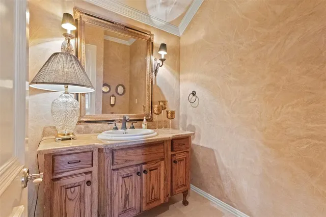 a bathroom with a sink a vanity and a mirror