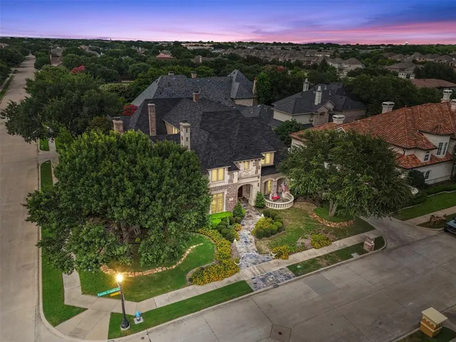 a view of a city with lush green forest