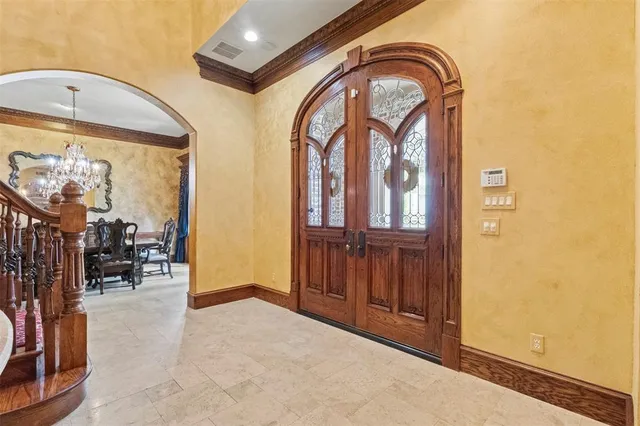 an entryway with a mirror