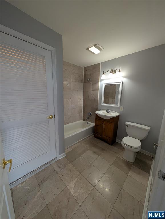 19 Market Street, Unit 405 Paterson, NJ 07501 - Photo 12 of 14 a bathroom with a toilet sink and shower