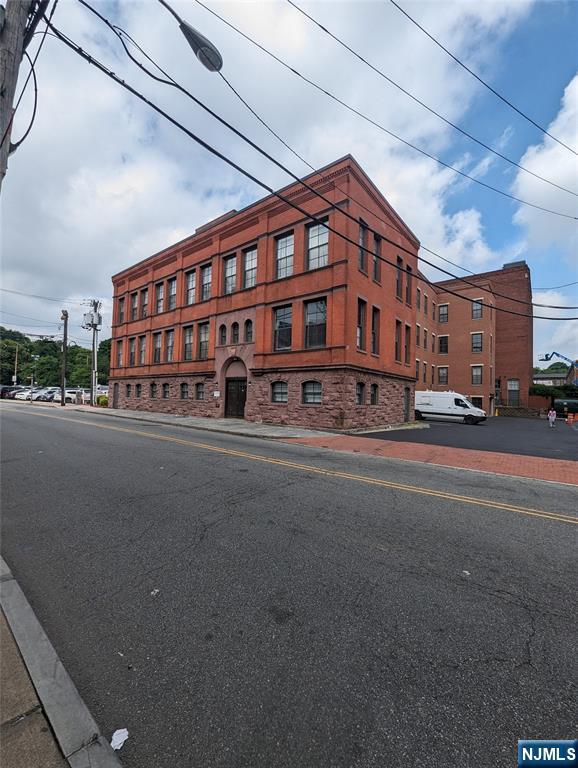 19 Market Street, Unit 405 Paterson, NJ 07501 - Photo 2 of 14 a large building with a street
