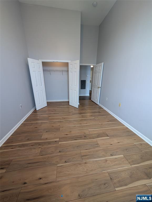 19 Market Street, Unit 405 Paterson, NJ 07501 - Photo 8 of 14 a view of empty room with wooden floor