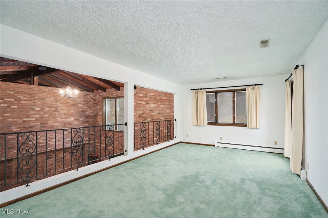 2671 Spring Valley Boulevard Mogadore, OH 44260 - Photo 20 of 23 Looking into Bonus Room from Mezzanine on main level. Virtually Unstaged