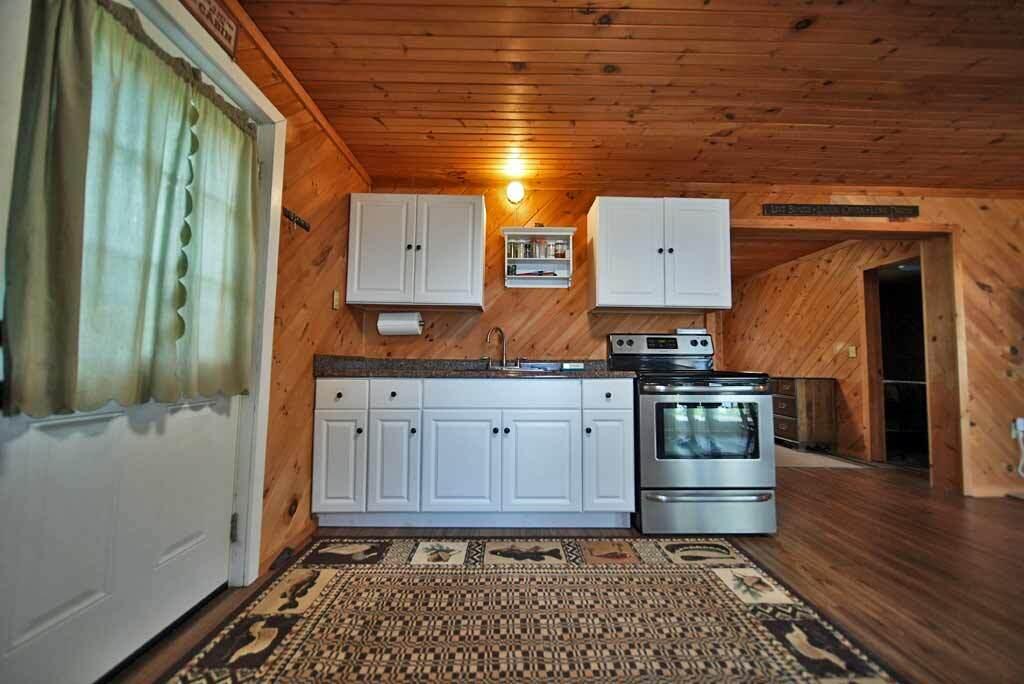 387 Boulder Road Danforth, ME 04424 - Photo 18 of 79 kitchen-knotty-pine-lake