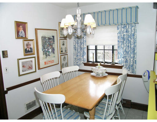 25 West Boulevard Road Newton, MA 02459 - Photo 3 of 8 a view of a dining room with furniture and chandelier