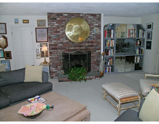 25 West Boulevard Road Newton, MA 02459 - Photo 6 of 8 a living room with furniture and a fireplace