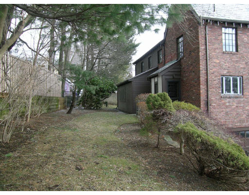 25 West Boulevard Road Newton, MA 02459 - Photo 8 of 8 a backyard of a house with table and chairs
