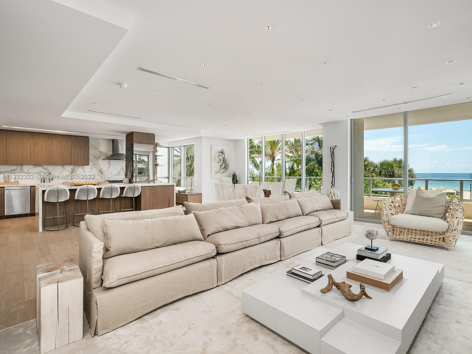 125 Ocean Drive, Unit U0301 Miami Beach, FL 33139 - Photo 11 of 15 a living room with furniture and a large window